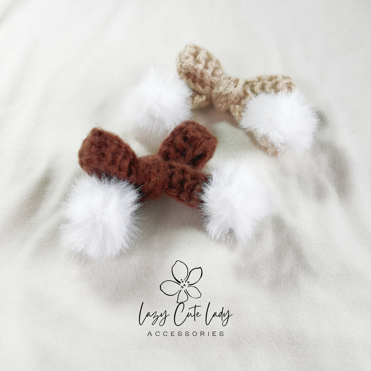 Knitted Bow Hair Clip with Plush White Ball Accent