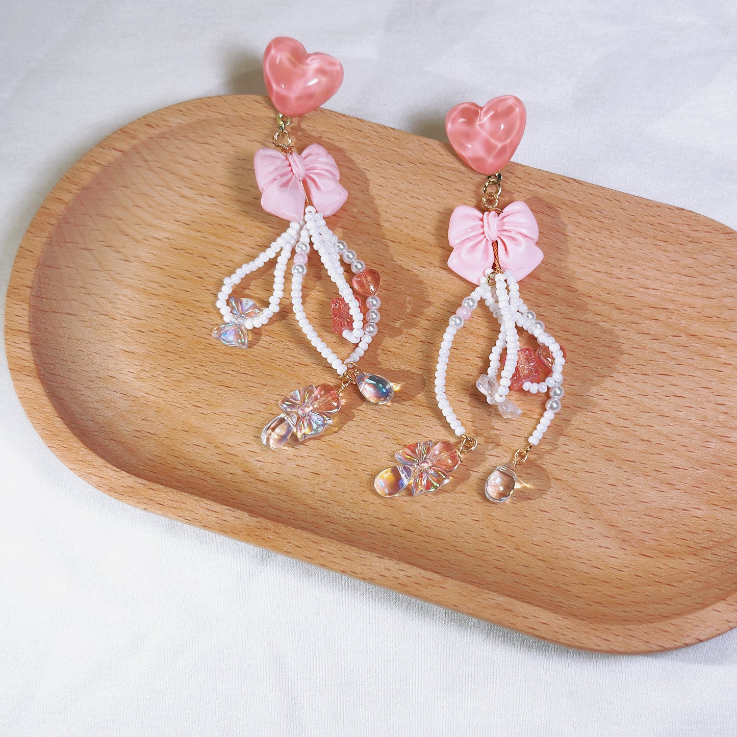 Pink Love Delight: Handcrafted Heart and Bow Earrings with Creative Bead Accents