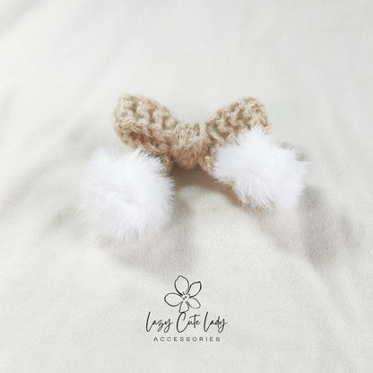 Knitted Bow Hair Clip with Plush White Ball Accent