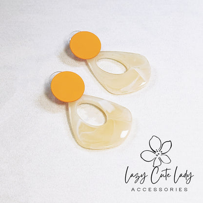 Chic Geometric Acetate Earrings with Orange and Beige Drops